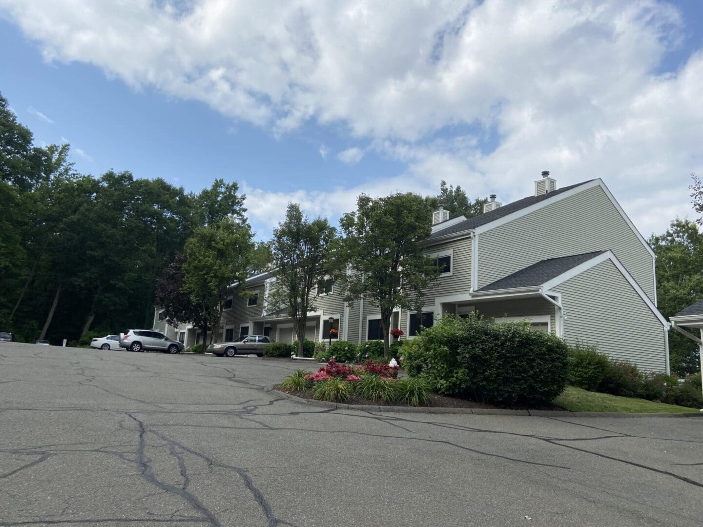 A street with cars parked on the side of it.