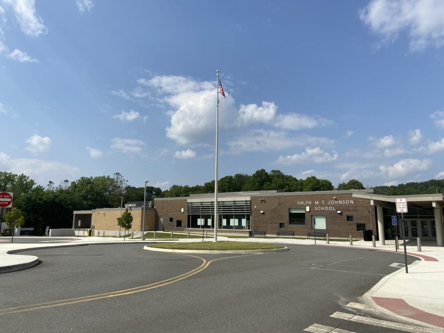 A large building with a flag flying in the middle of it.