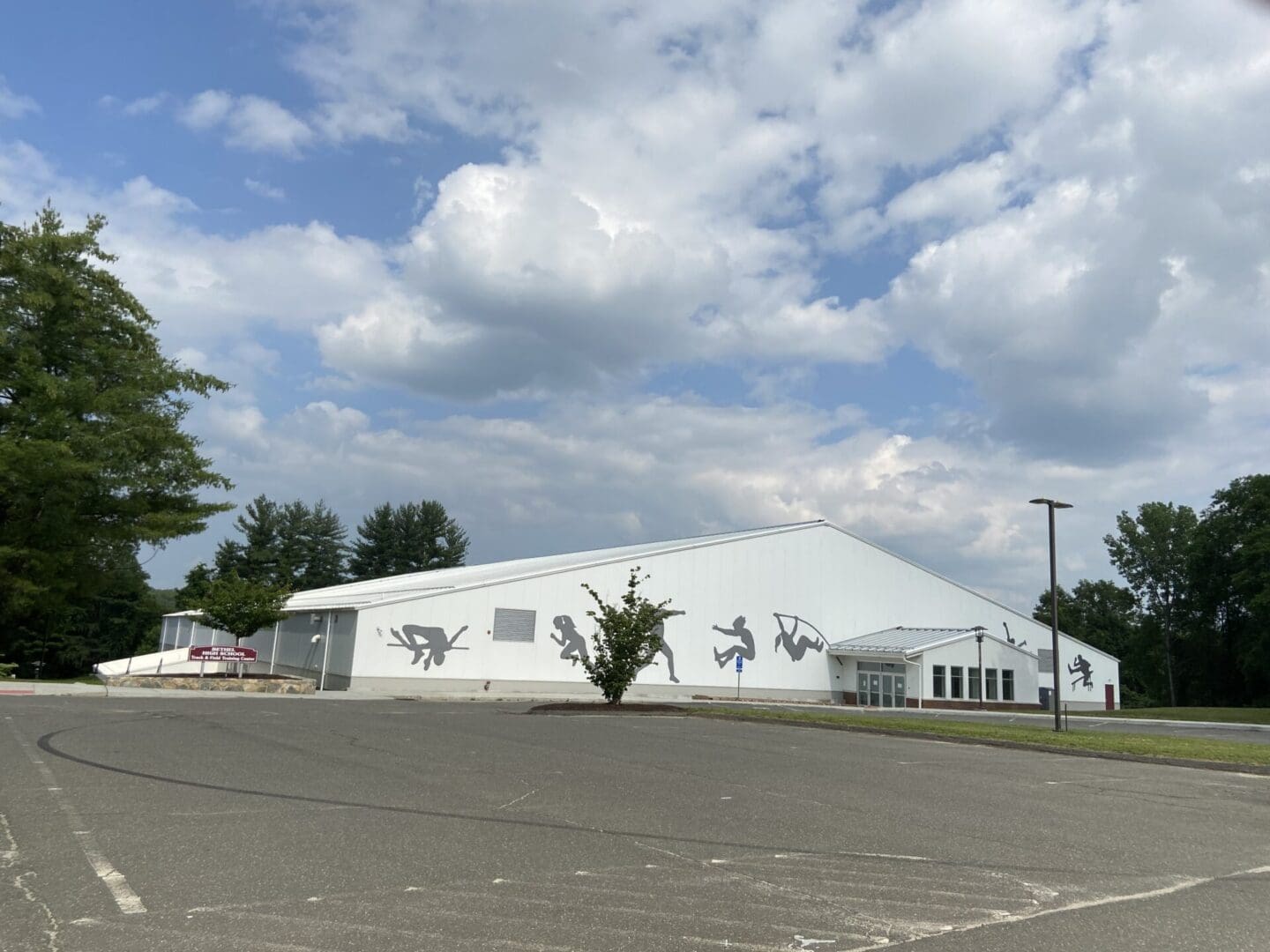 A large white tent with graffiti on it.