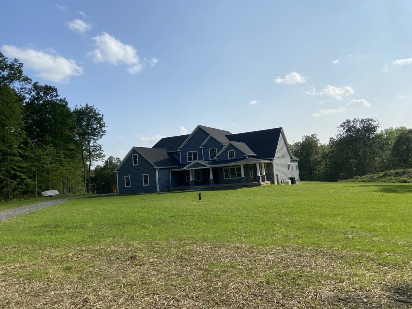 A large house sitting on top of a green field.