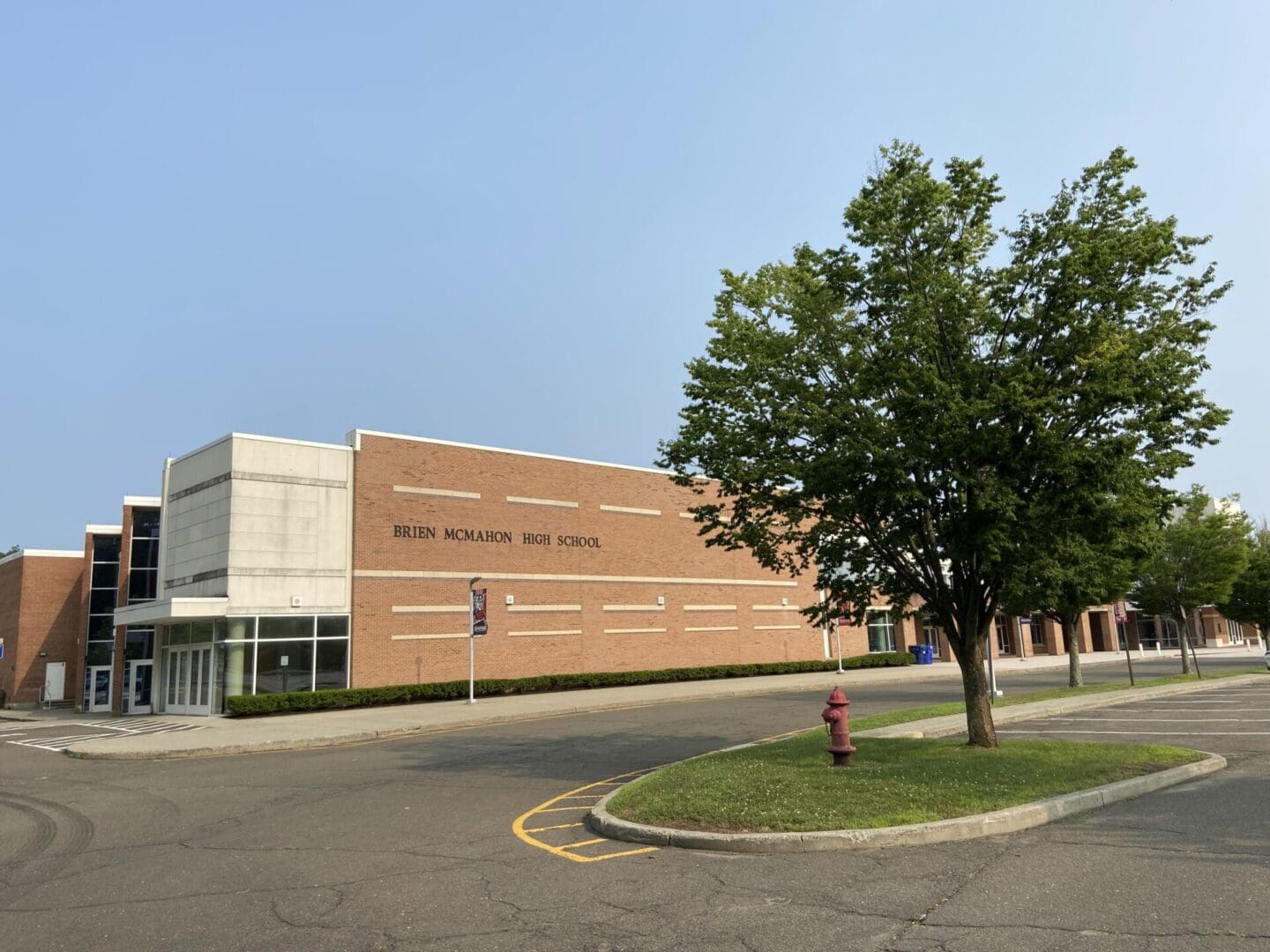 A building with a tree in front of it.