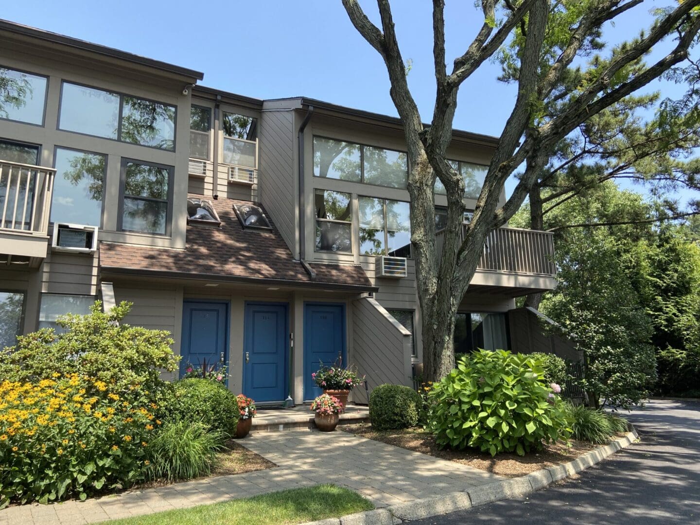 A building with blue doors and windows on the side of it.