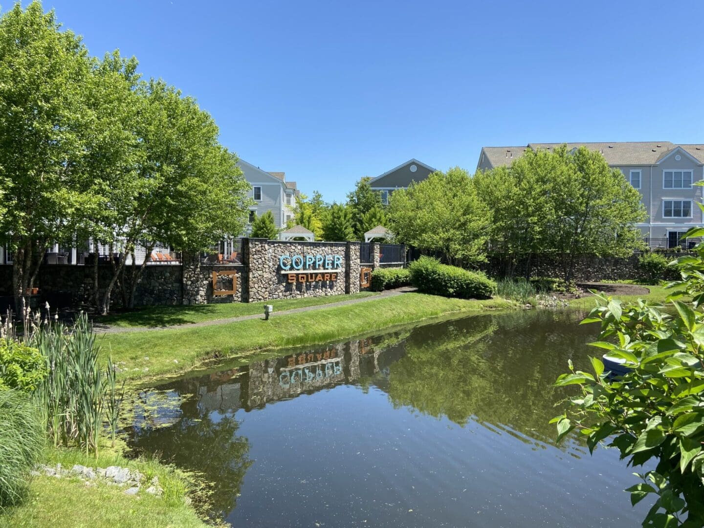 Pond view of Copper Square community.