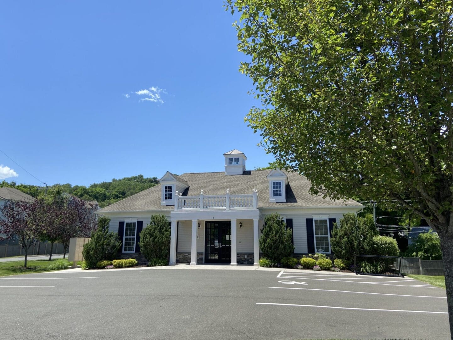 White building with a handicap symbol.