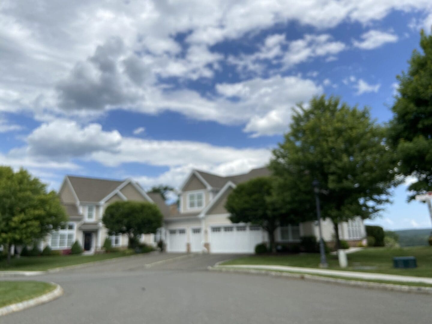 Suburban neighborhood with houses and trees.