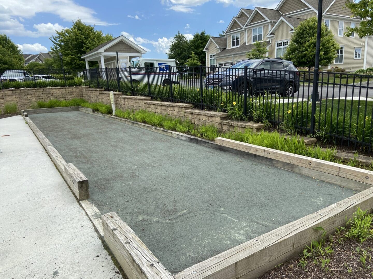 Bocce ball court with wooden borders.