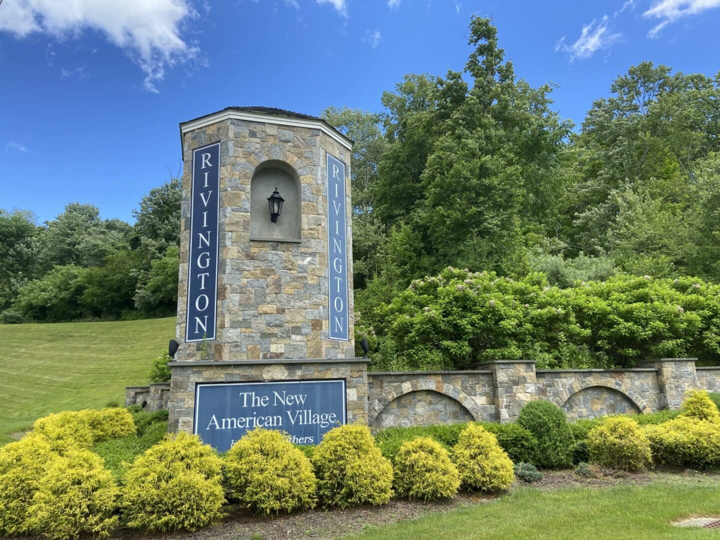 The New American Village entrance sign.