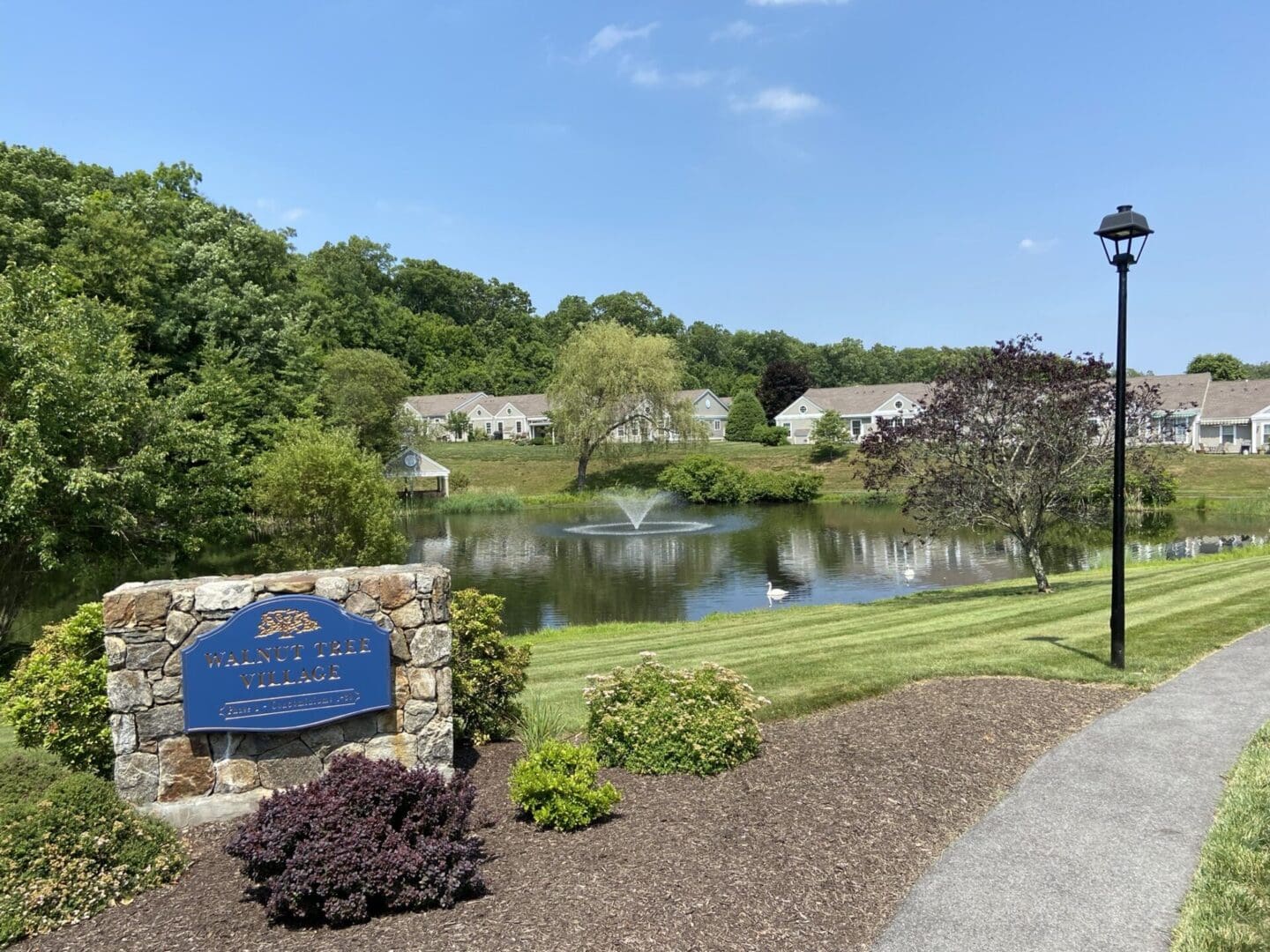 Walnut Tree Village entrance with pond.