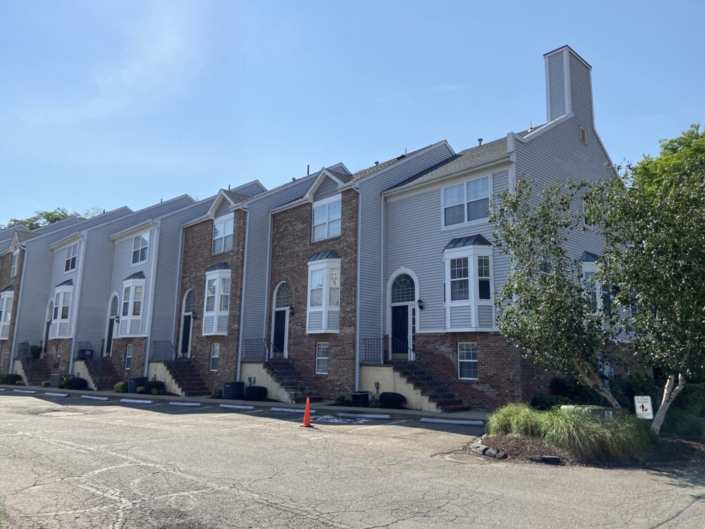 Row of townhouses, parking lot.