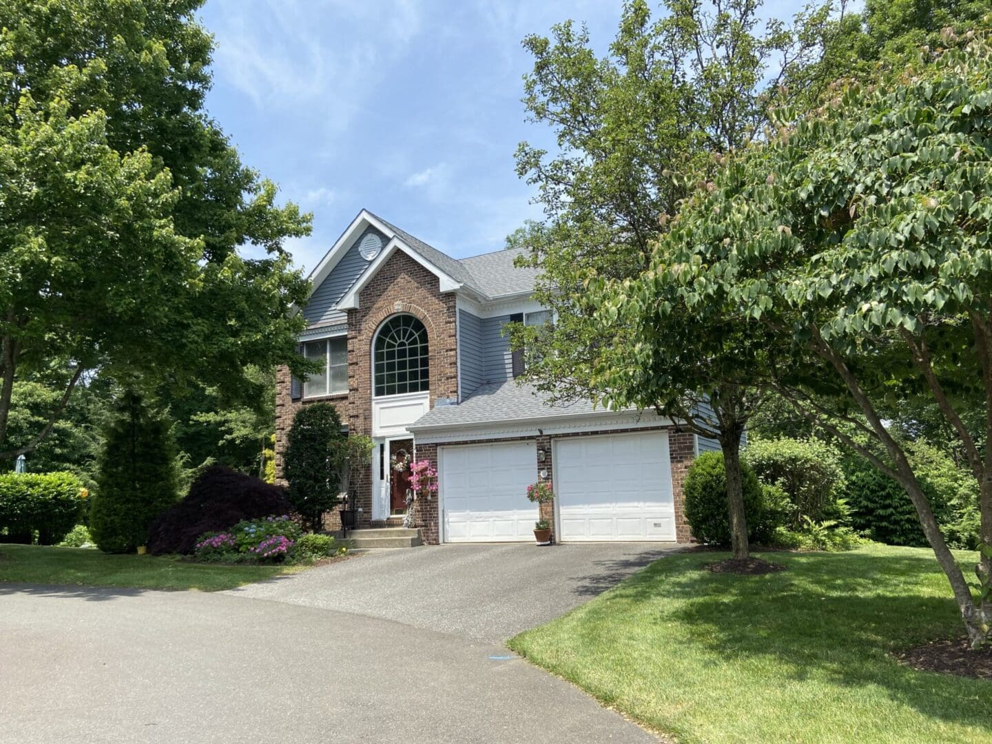 Brick house with a two-car garage.