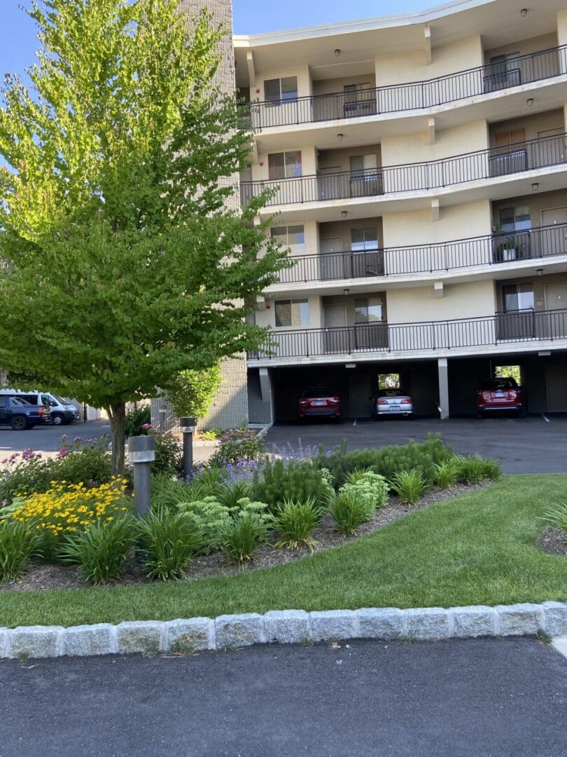 Apartment building with green landscaping.