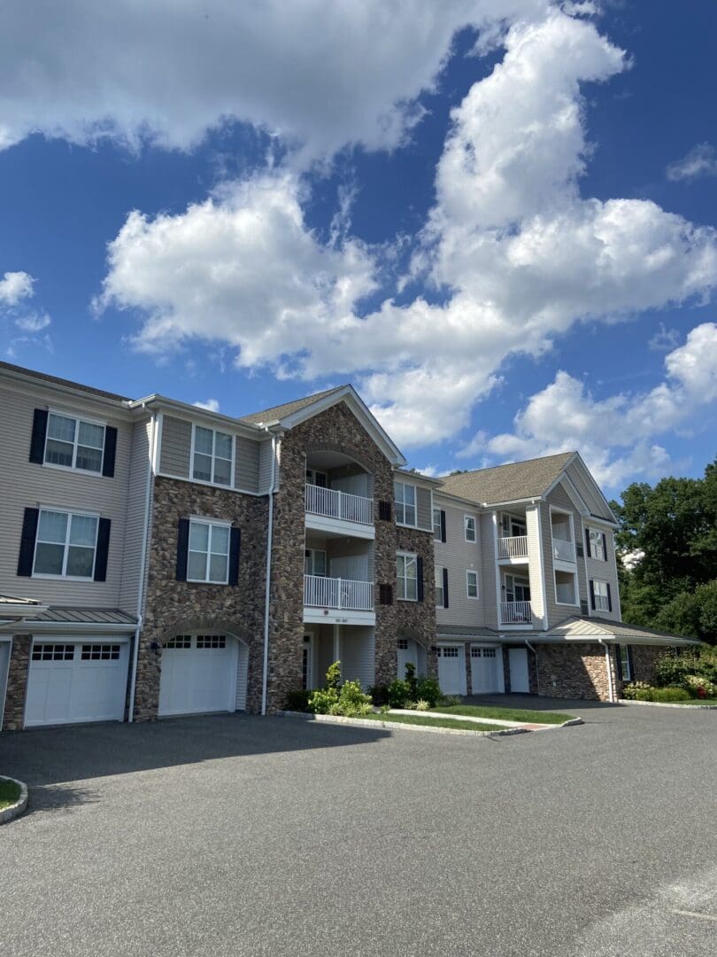 Beige apartment building with a blue sky.