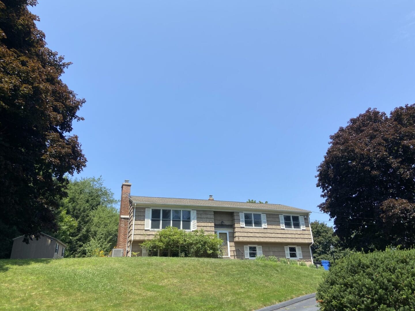 A two-story suburban home with a lawn.