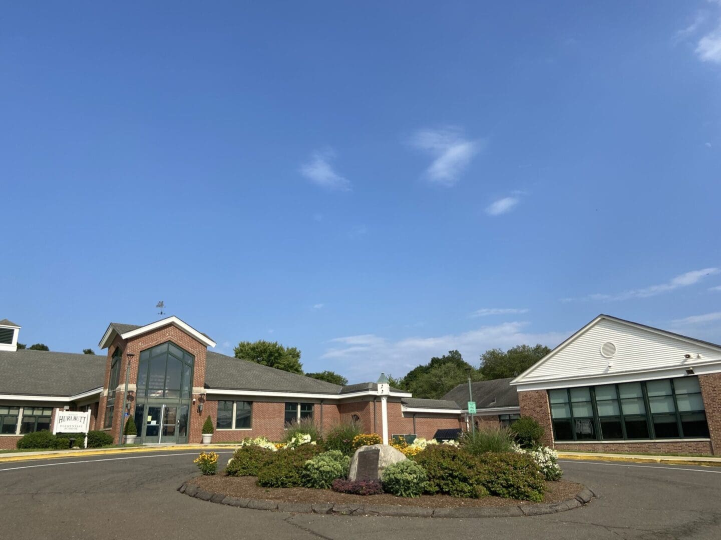 Hurebutt Elementary School building with blue sky.