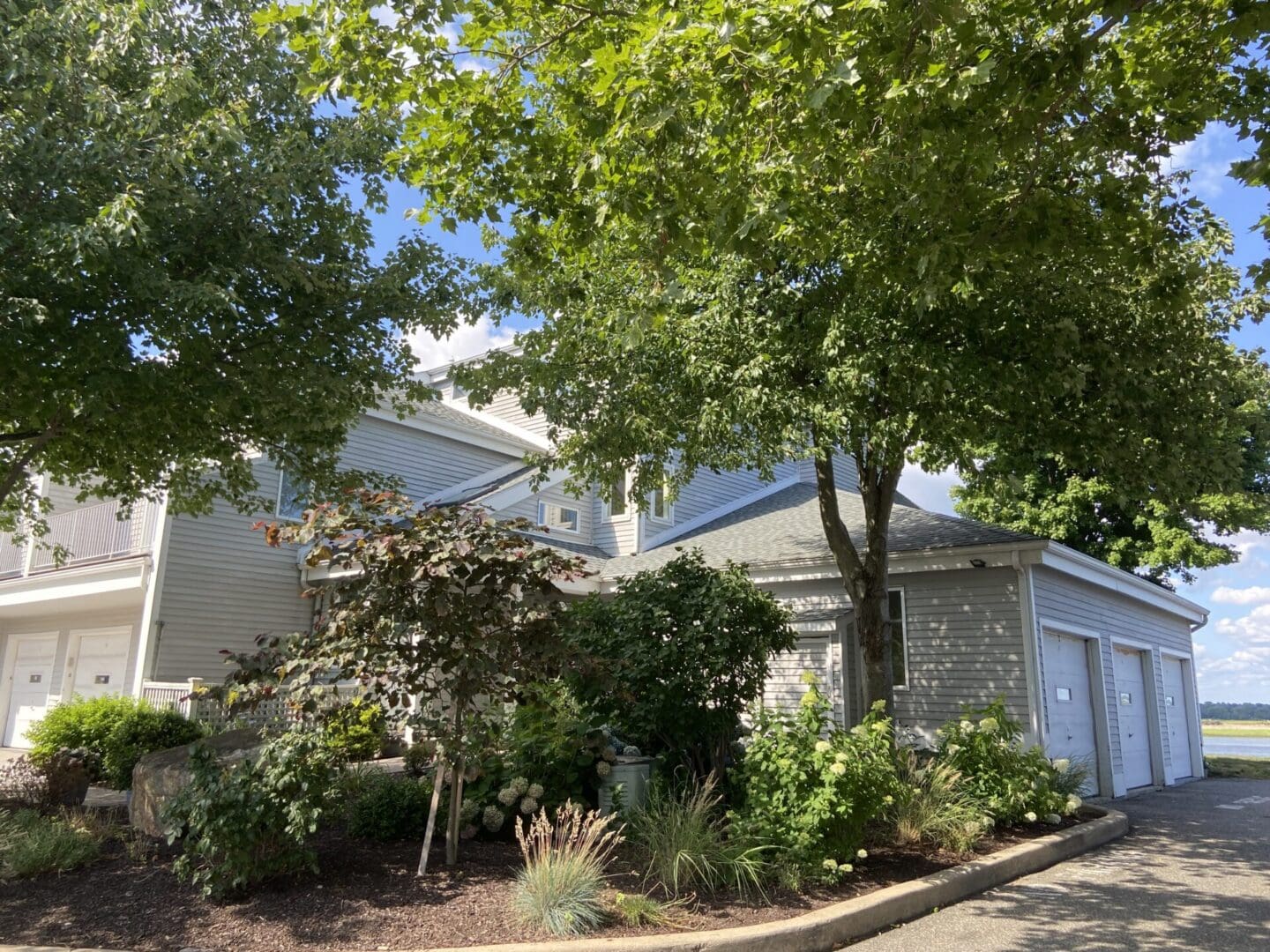 Gray house with three-car garage.