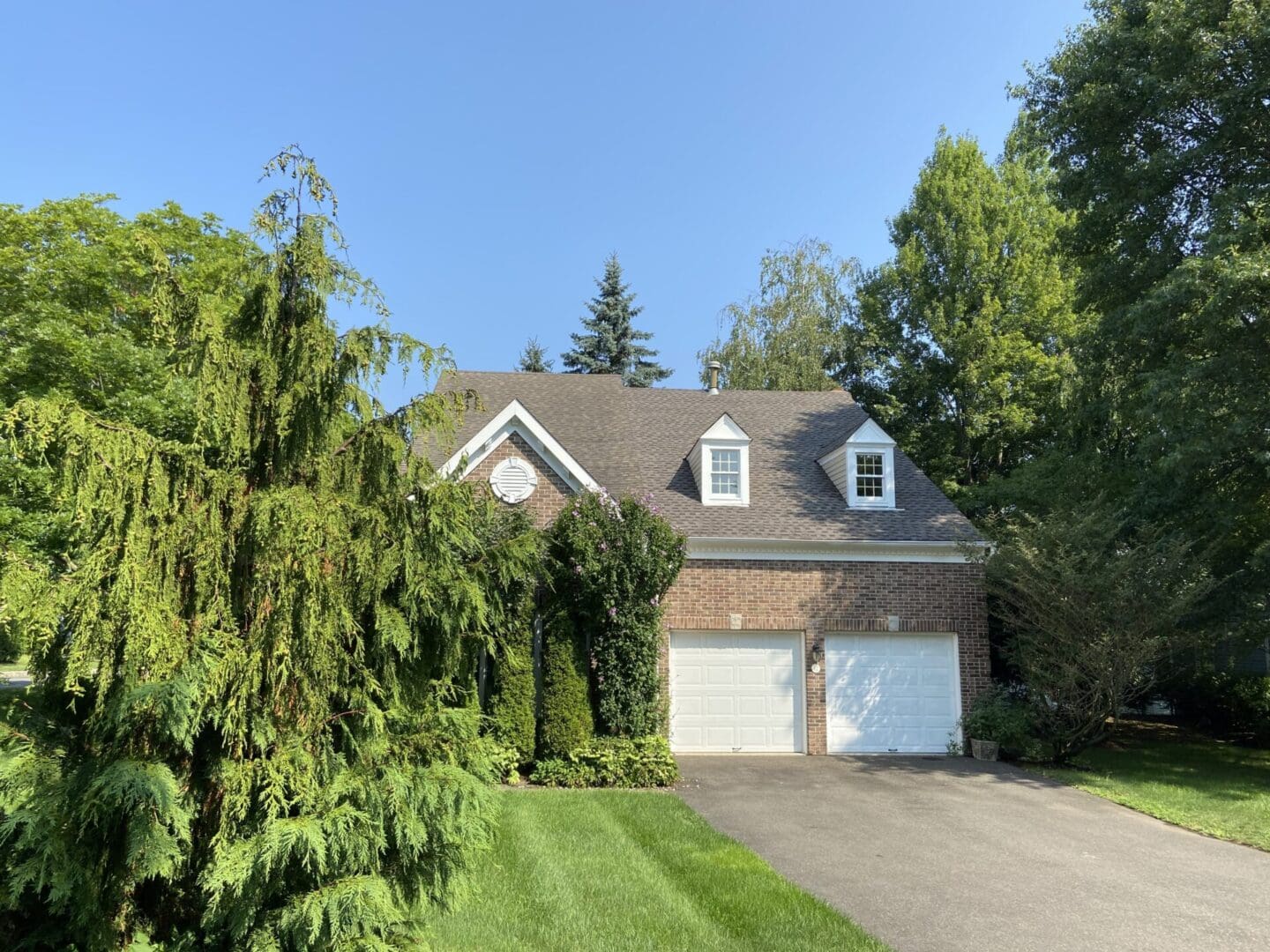 Brick house with two-car garage.