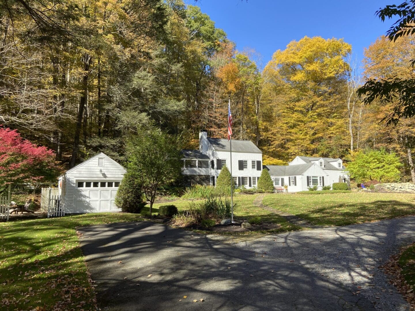 White houses in a wooded landscape.